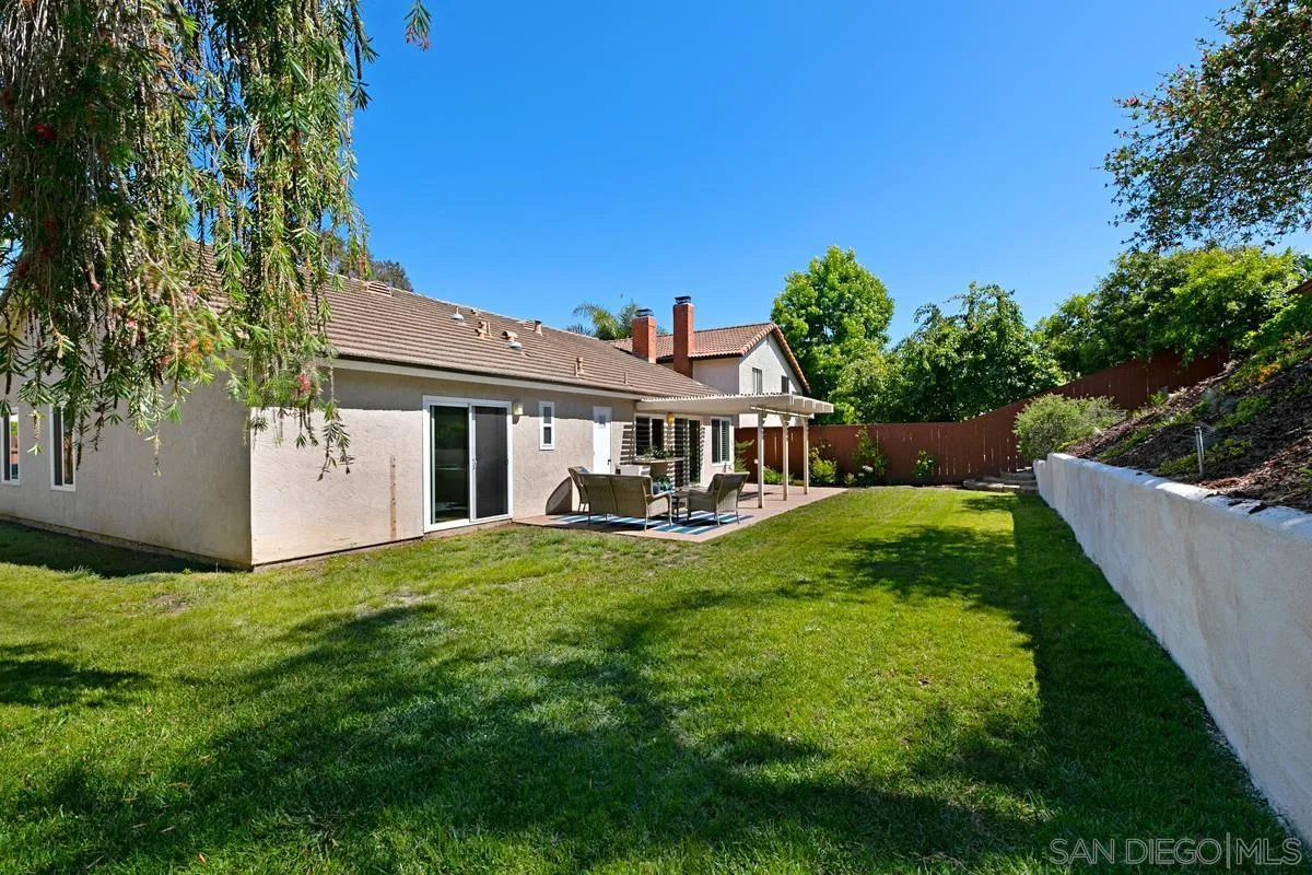 574 Gardendale Road Encinitas, CA 92024 - Photo 28 of 53 a view of a house with a yard deck and a small yard