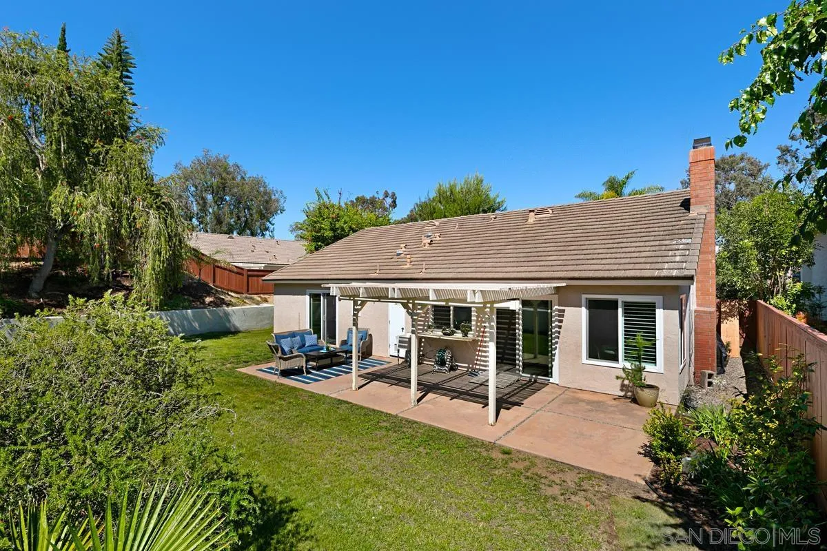 574 Gardendale Road Encinitas, CA 92024 - Photo 31 of 53 a view of a house with backyard porch and sitting area