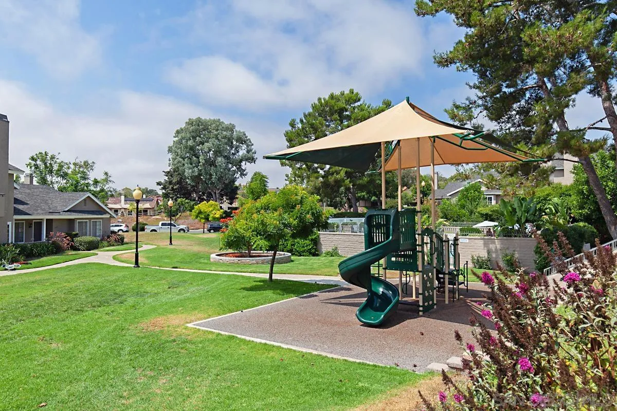 574 Gardendale Road Encinitas, CA 92024 - Photo 36 of 53 a view of a table and chairs under an umbrella