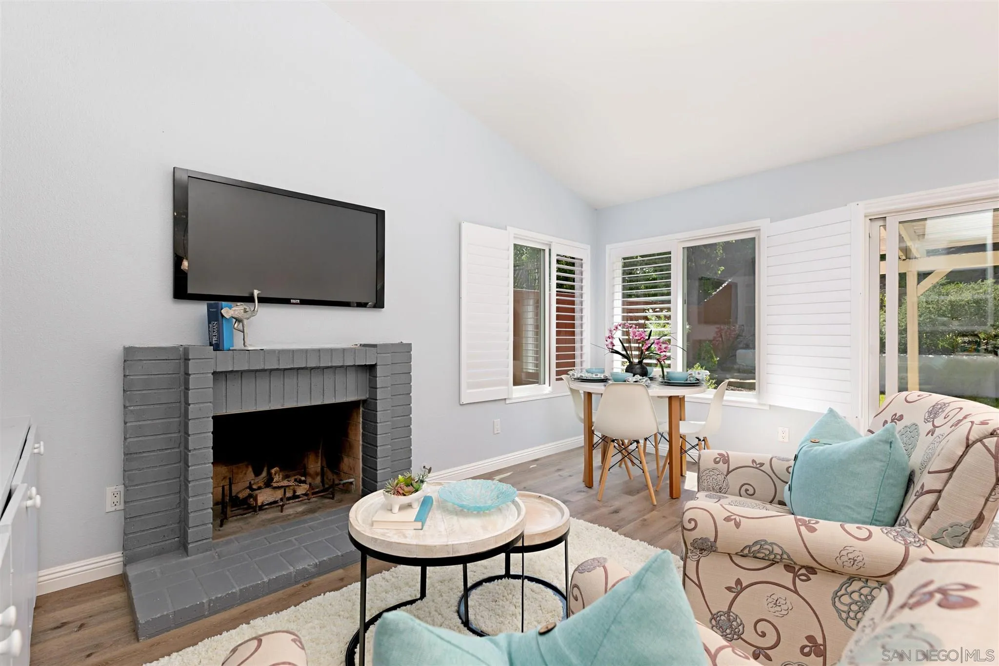 574 Gardendale Road Encinitas, CA 92024 - Photo 8 of 53 a living room with furniture a fireplace and a flat screen tv