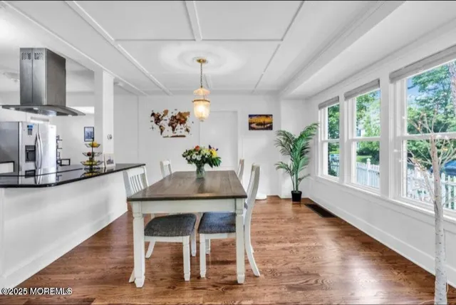 a view of a room with a white walls