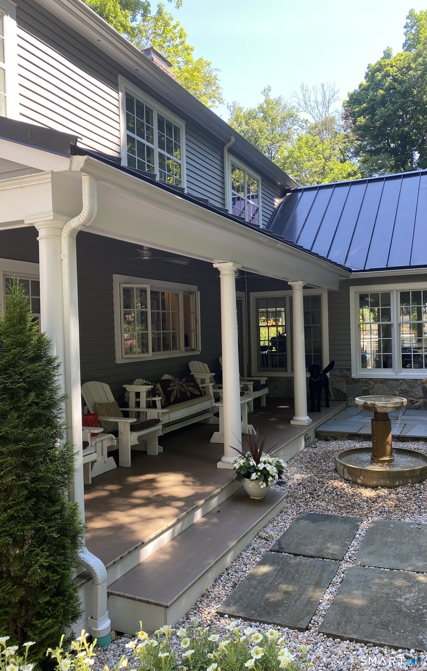 250 Ivy Hill Road Ridgefield, CT 06877 - Photo 14 of 45 a view of a house with sitting area and garden