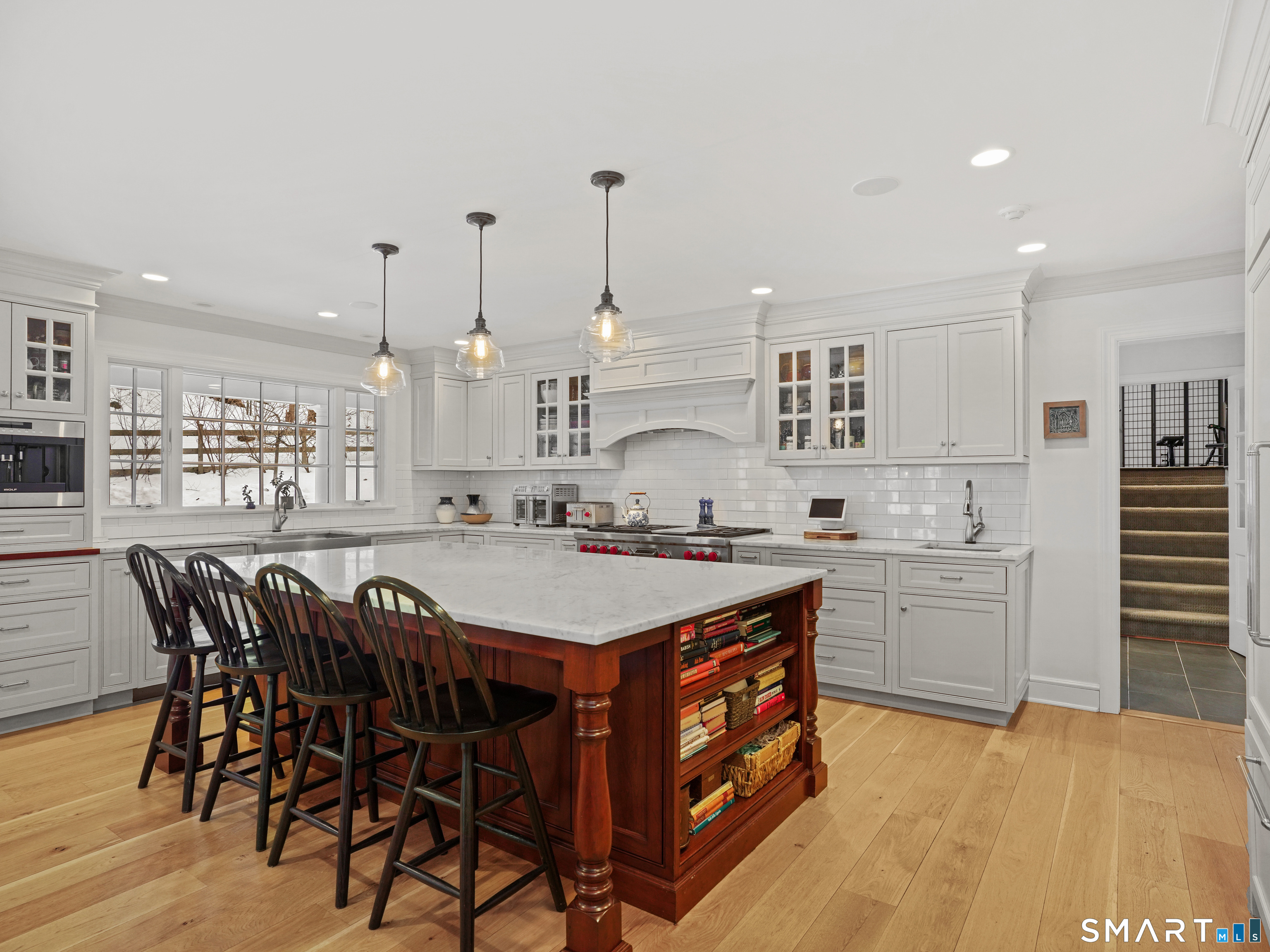 250 Ivy Hill Road Ridgefield, CT 06877 - Photo 15 of 45 a large kitchen with kitchen island a sink table and chairs