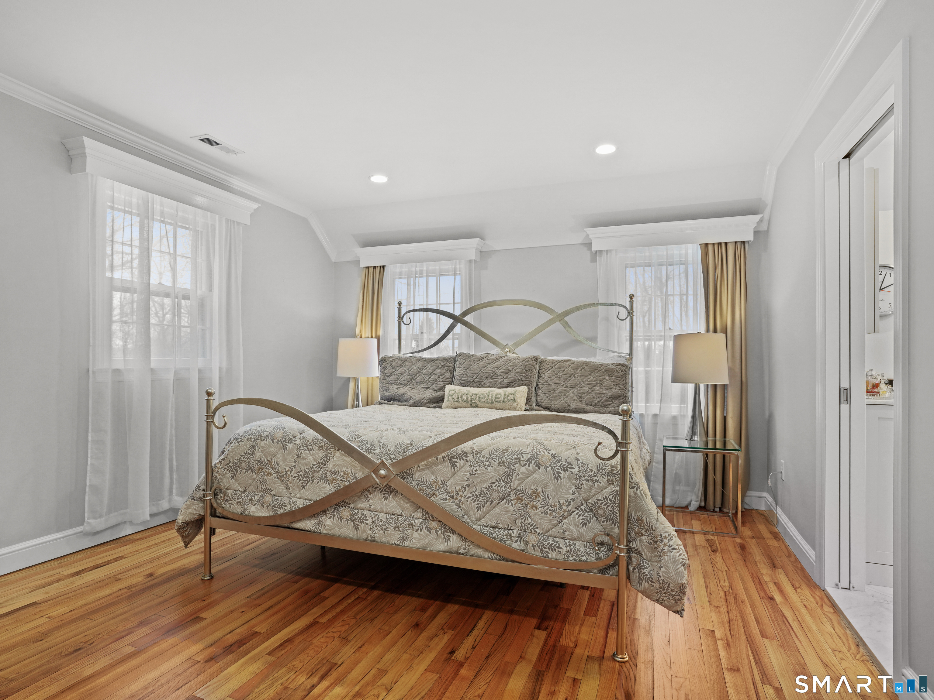 250 Ivy Hill Road Ridgefield, CT 06877 - Photo 29 of 45 a bedroom with a bed and wooden floor