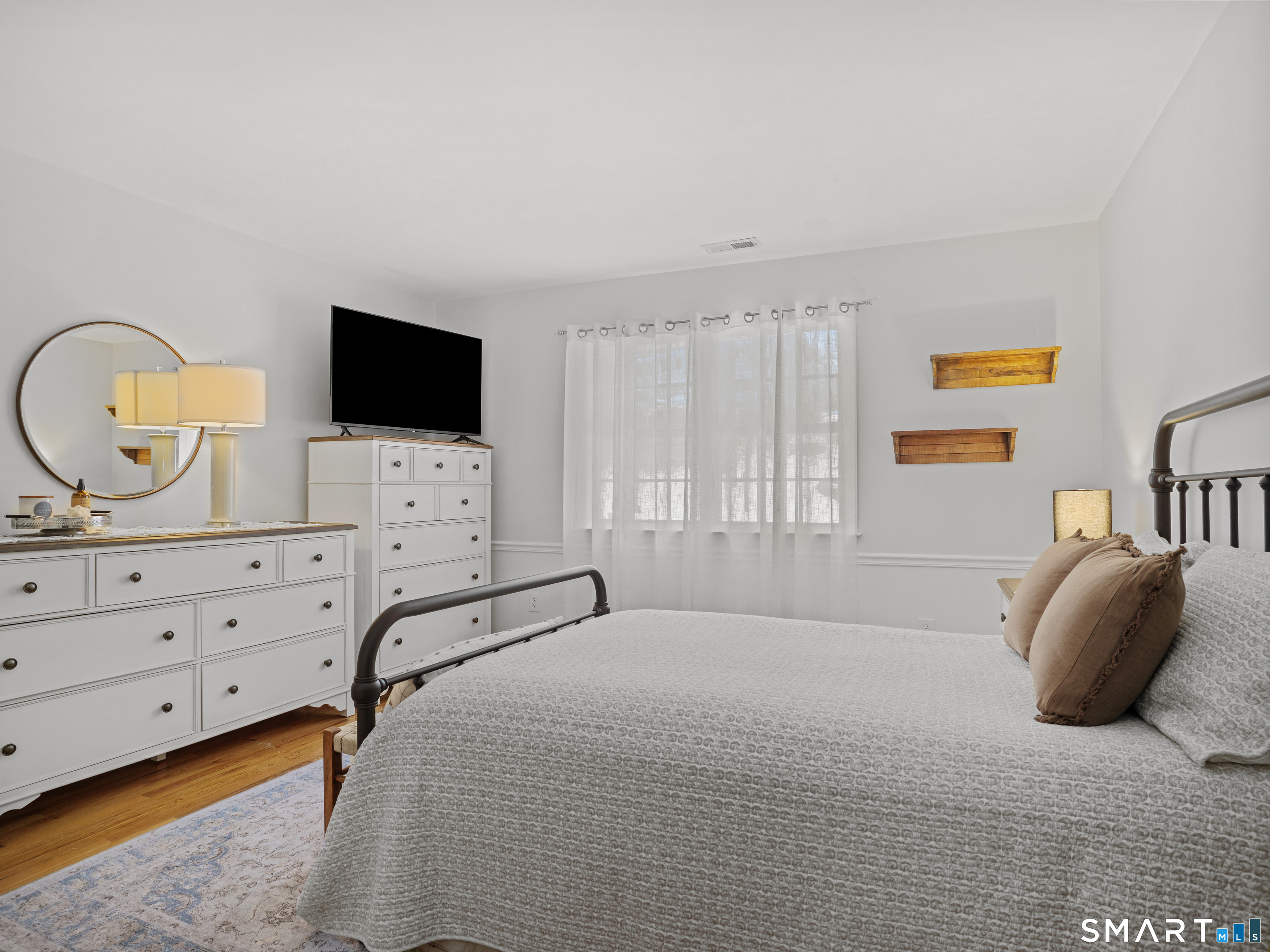 250 Ivy Hill Road Ridgefield, CT 06877 - Photo 35 of 45 a bedroom with a bed and a flat screen tv