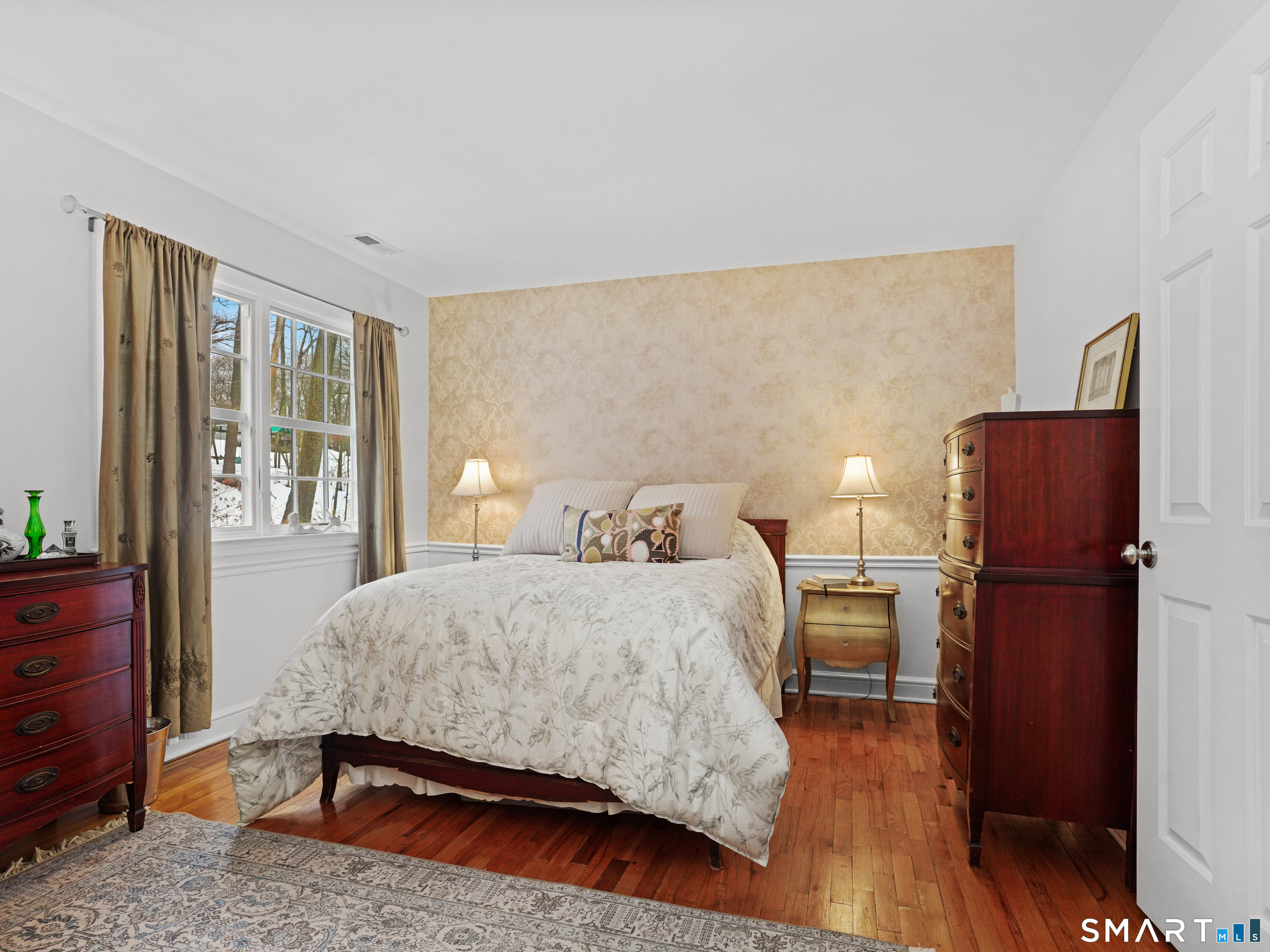 250 Ivy Hill Road Ridgefield, CT 06877 - Photo 38 of 45 a bedroom with a bed and wooden floor