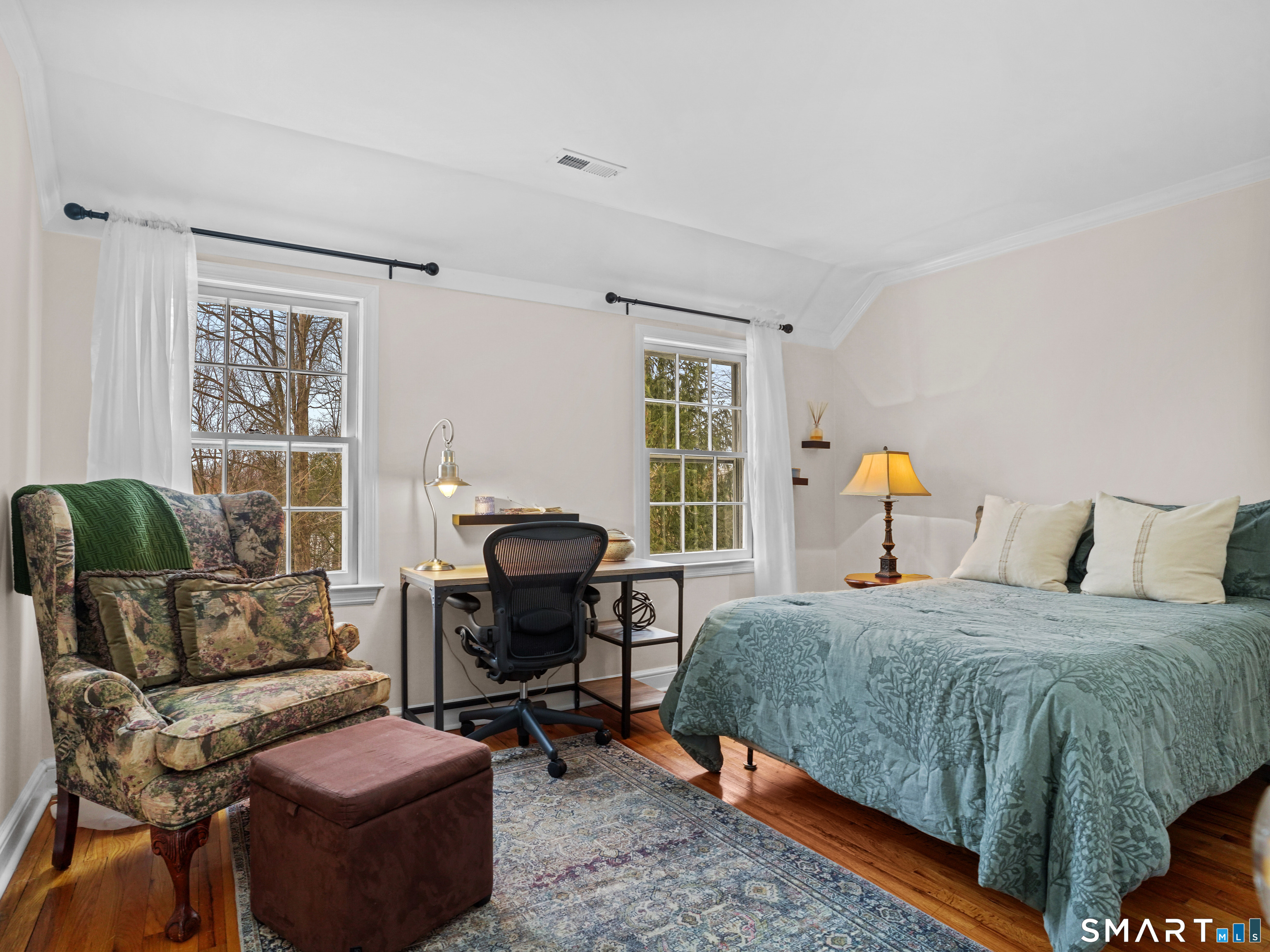 250 Ivy Hill Road Ridgefield, CT 06877 - Photo 39 of 45 a bedroom with a bed and wooden floor