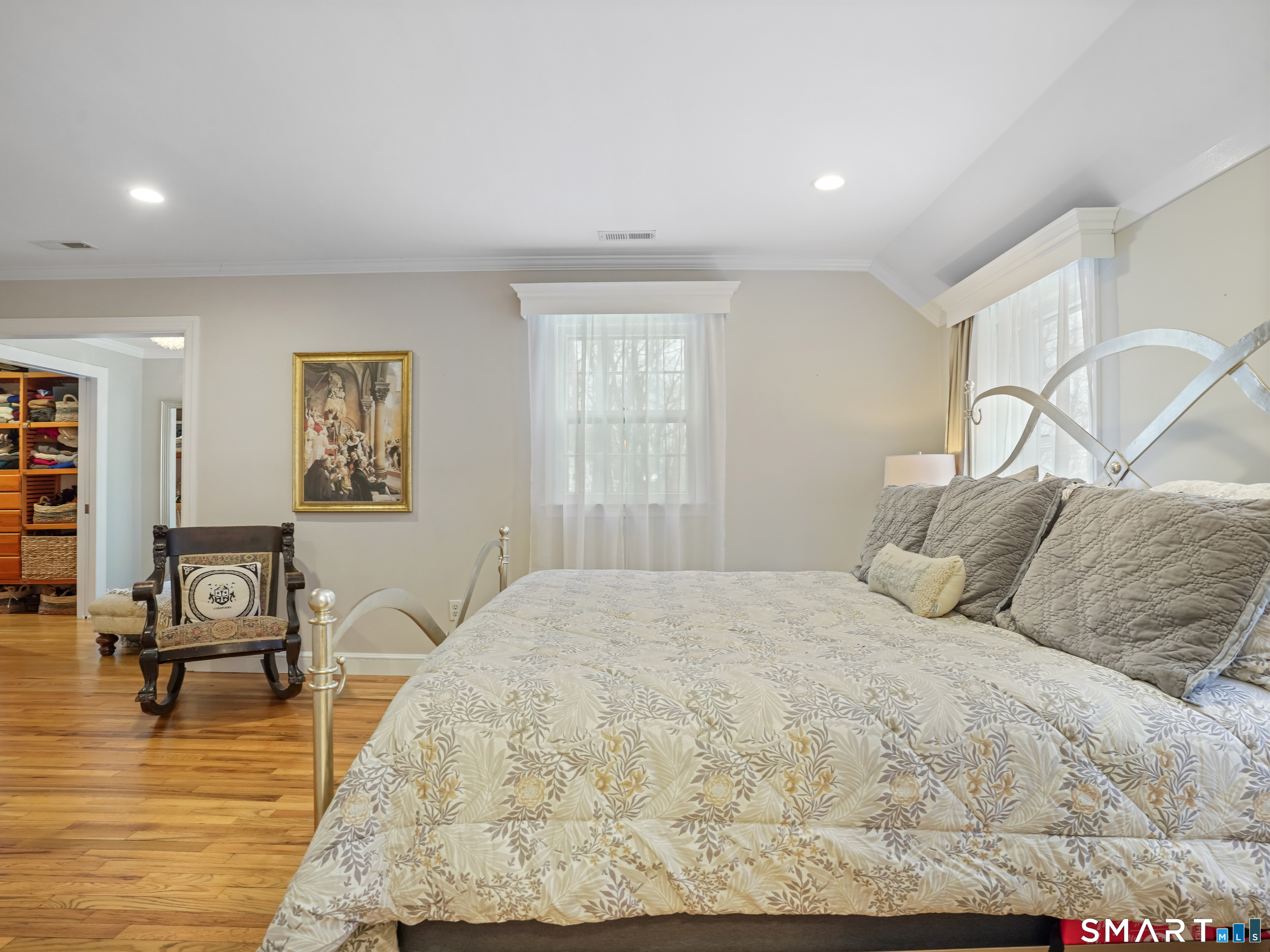 250 Ivy Hill Road Ridgefield, CT 06877 - Photo 42 of 45 a bedroom with a bed and wooden floor