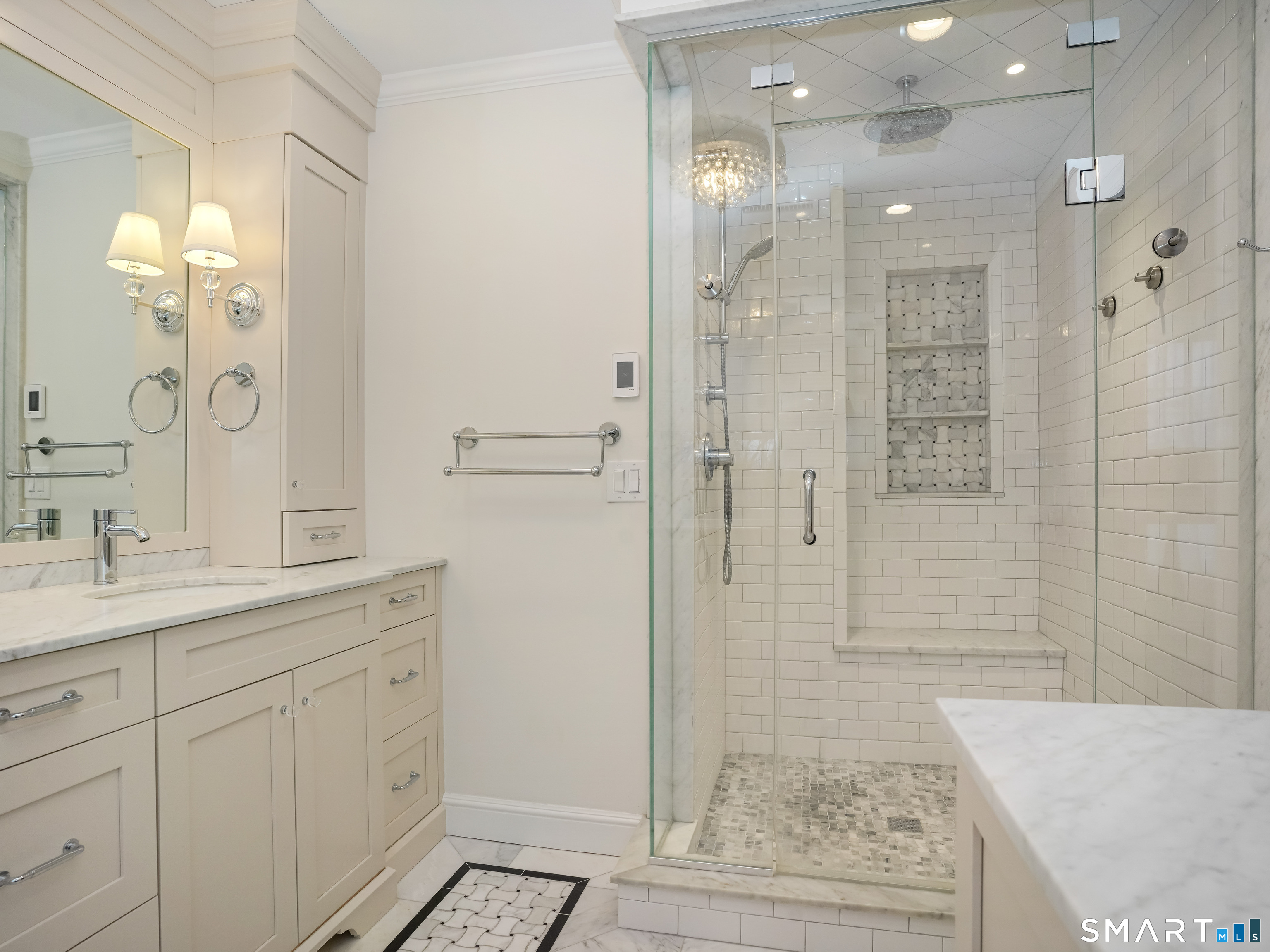 250 Ivy Hill Road Ridgefield, CT 06877 - Photo 43 of 45 a bathroom with a shower sink and mirror