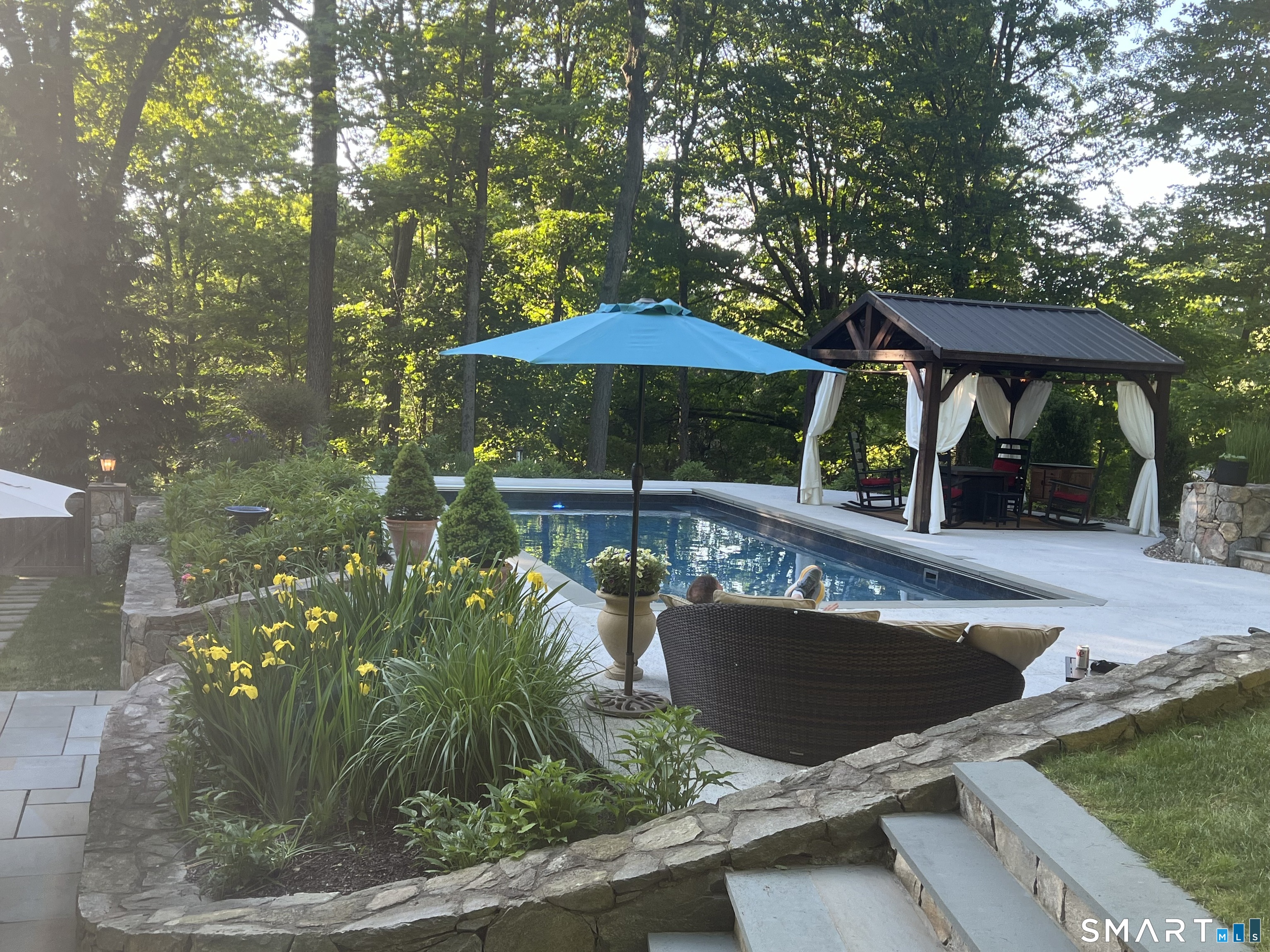 250 Ivy Hill Road Ridgefield, CT 06877 - Photo 5 of 45 a view of a chairs and table in the patio