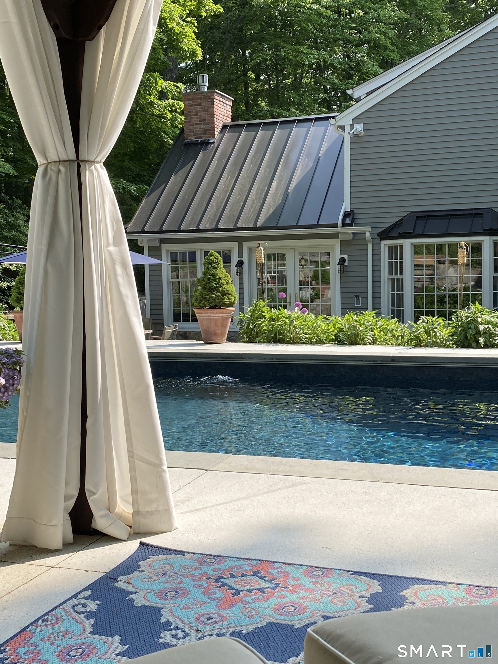 250 Ivy Hill Road Ridgefield, CT 06877 - Photo 8 of 45 a view of small yard in front of house with outdoor seating