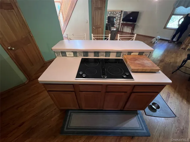 a stove top oven sitting inside of a kitchen