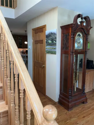 a view of entryway with wooden floor