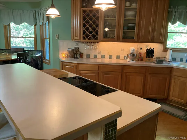 a kitchen with a sink a stove and cabinets