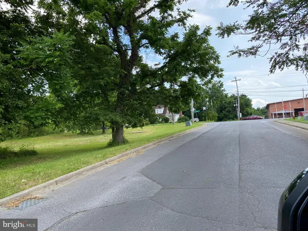 a view of a street with a houses on both side of it
