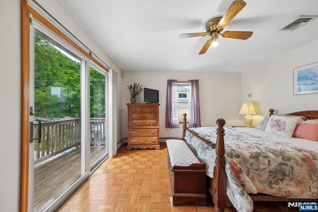 562 Valley Road Clifton, NJ 07013 - Photo 21 of 35 a living room with furniture and a floor to ceiling window