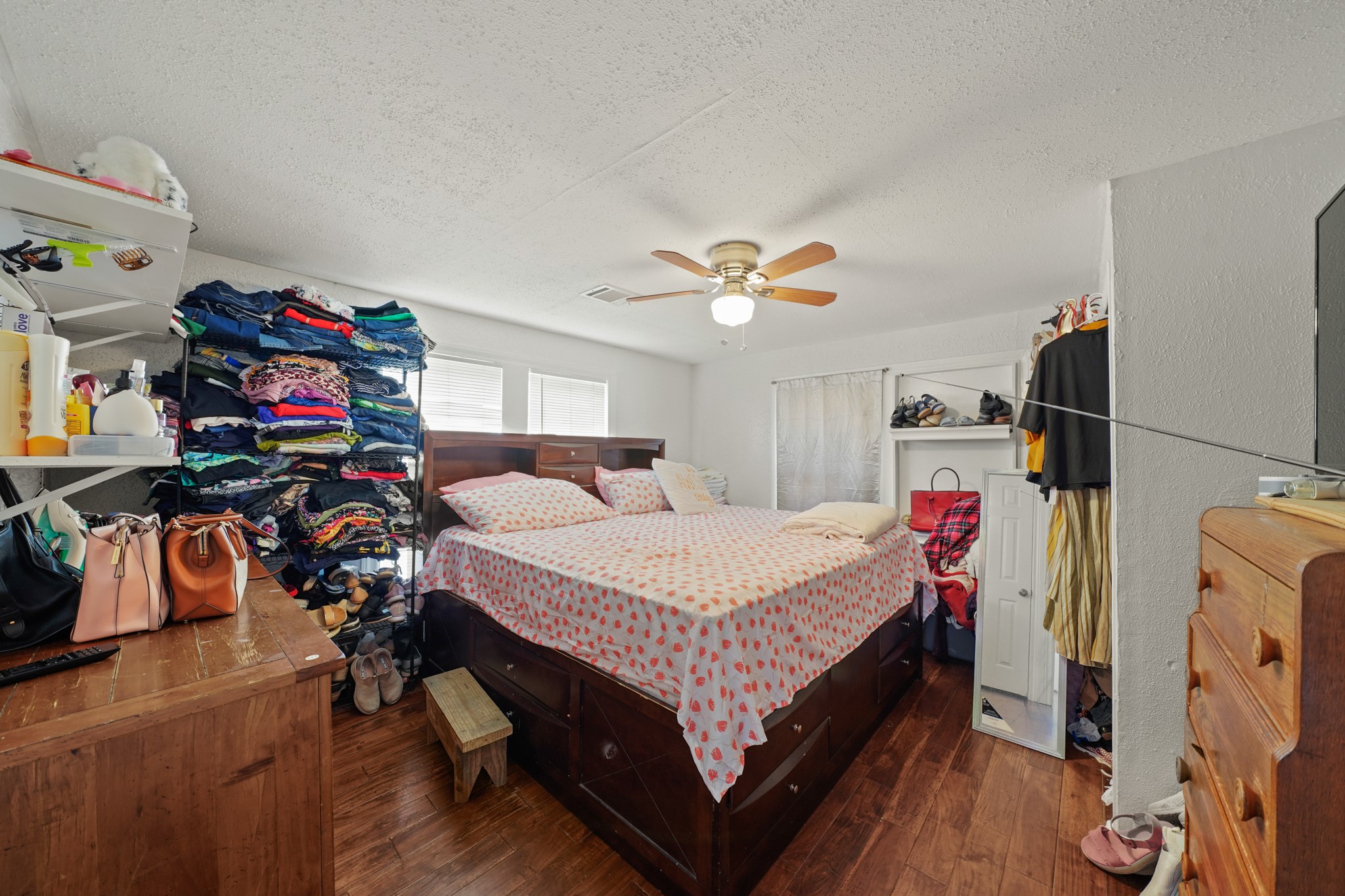 5307 Crane Street Houston, TX 77026 - Photo 12 of 41 4003 Lockwood -Charming bedroom featuring stylish wood-look flooring, a ceiling fan, and ample closet space at 4003 Lockwood St.