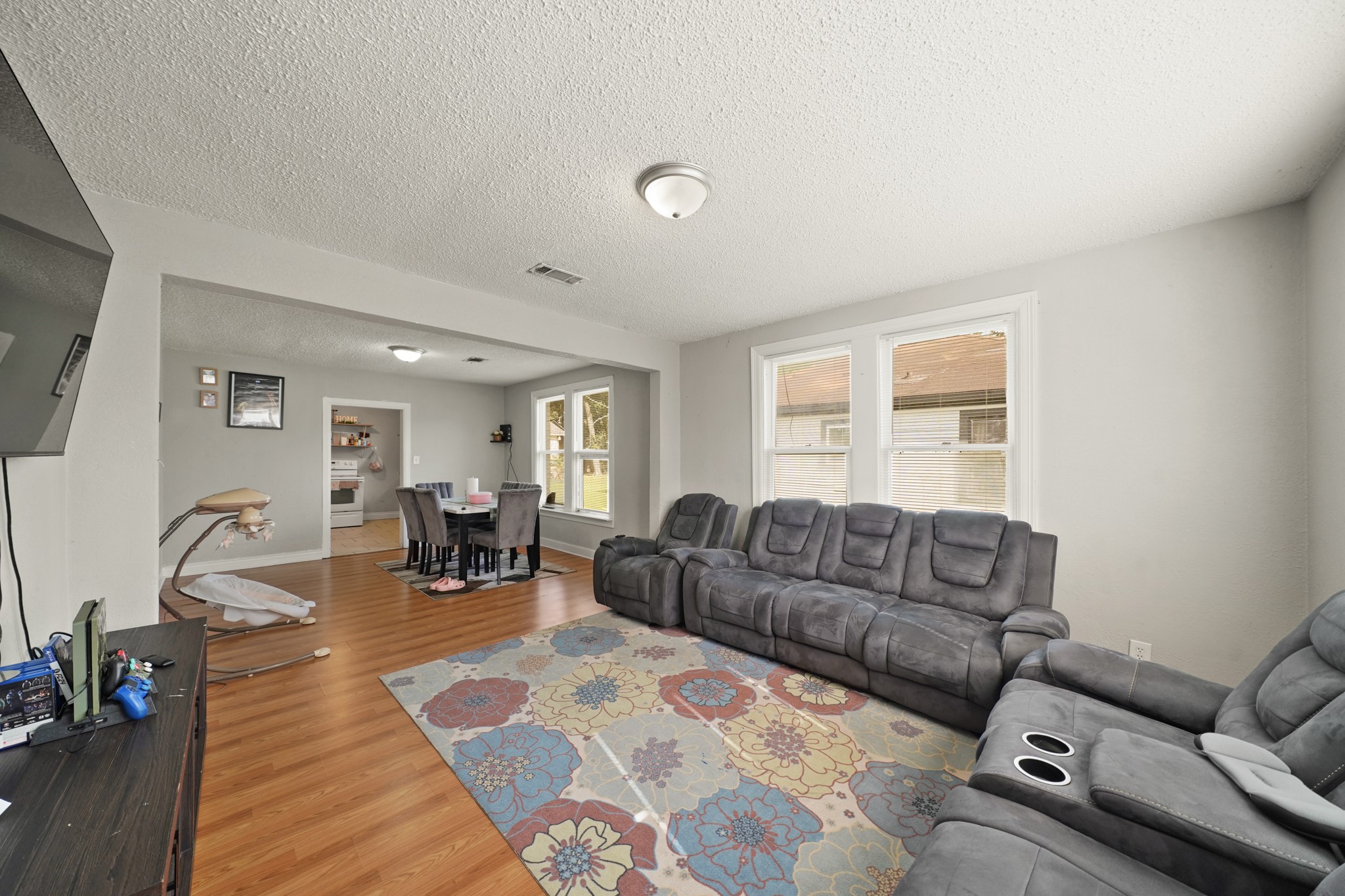 5307 Crane Street Houston, TX 77026 - Photo 20 of 41 a living room with furniture and wooden floor
