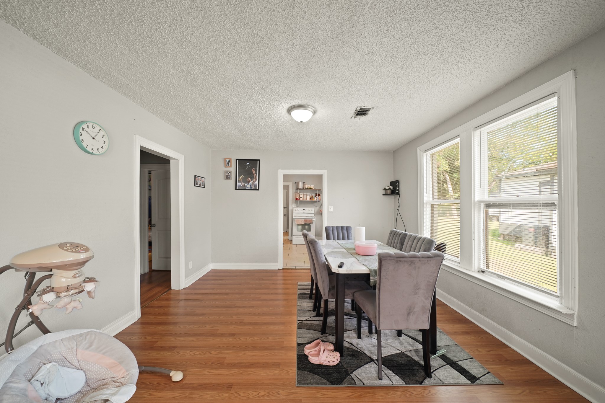 5307 Crane Street Houston, TX 77026 - Photo 22 of 41 a view of a dining room with furniture window and wooden floor