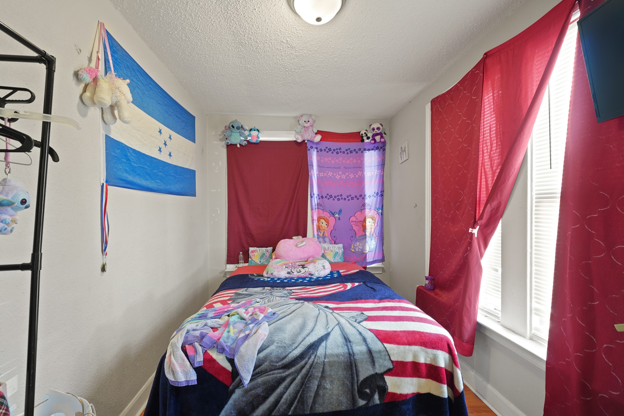 5307 Crane Street Houston, TX 77026 - Photo 26 of 41 a bedroom with a bed and a window