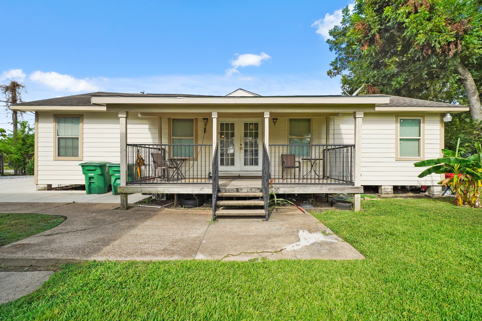 5307 Crane Street Houston, TX 77026 - Photo 3 of 41 a front view of a house with a yard and outdoor seating