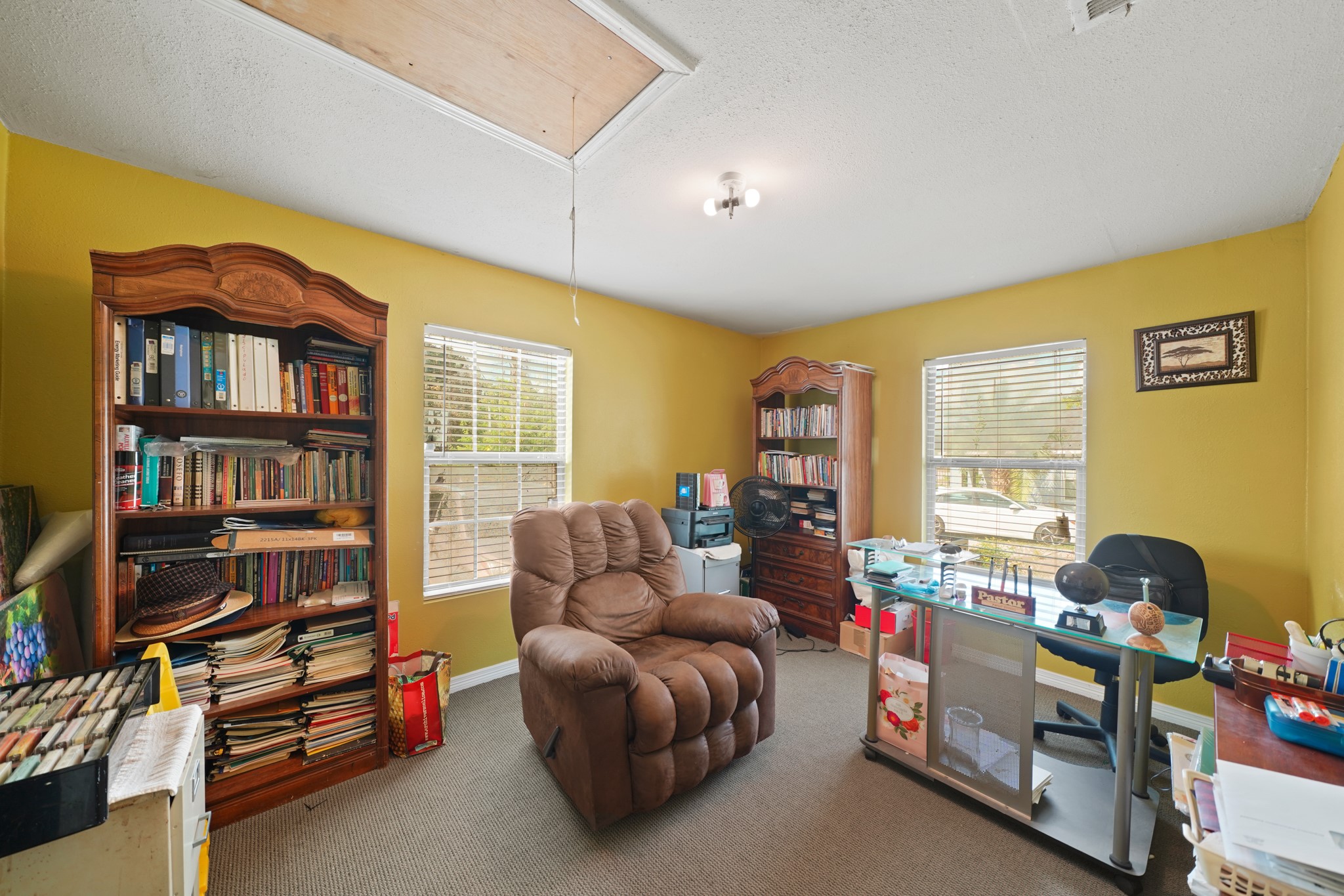 5307 Crane Street Houston, TX 77026 - Photo 34 of 41 a living room with furniture a window and a bookshelf