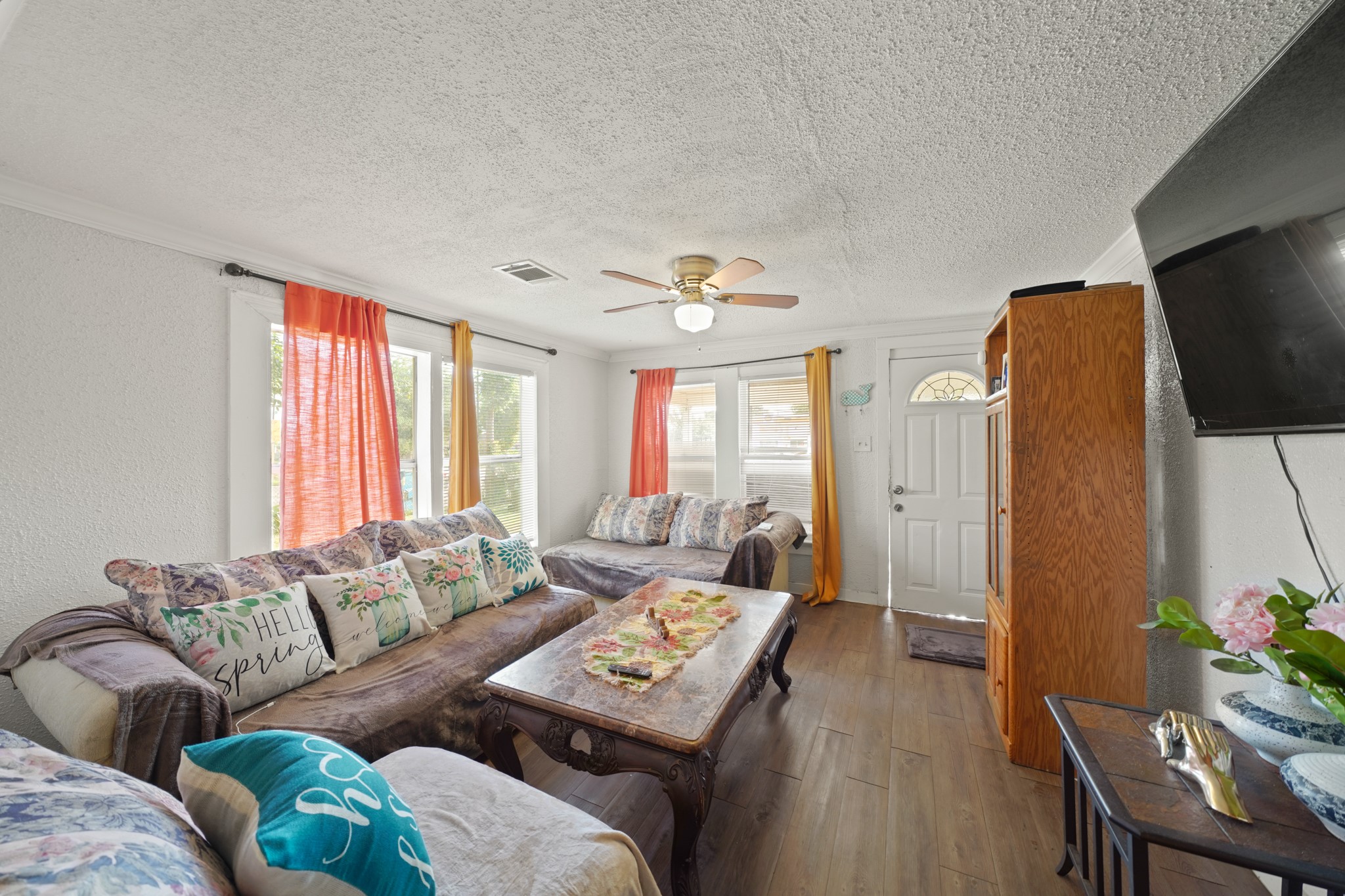 5307 Crane Street Houston, TX 77026 - Photo 5 of 41 a living room with furniture and a flat screen tv