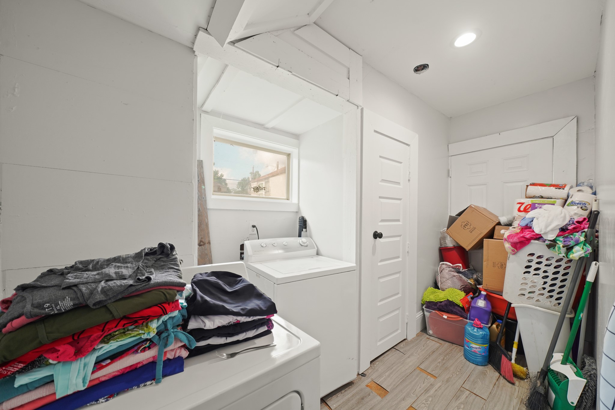5307 Crane Street Houston, TX 77026 - Photo 8 of 41 a bedroom with a bed and a chandelier