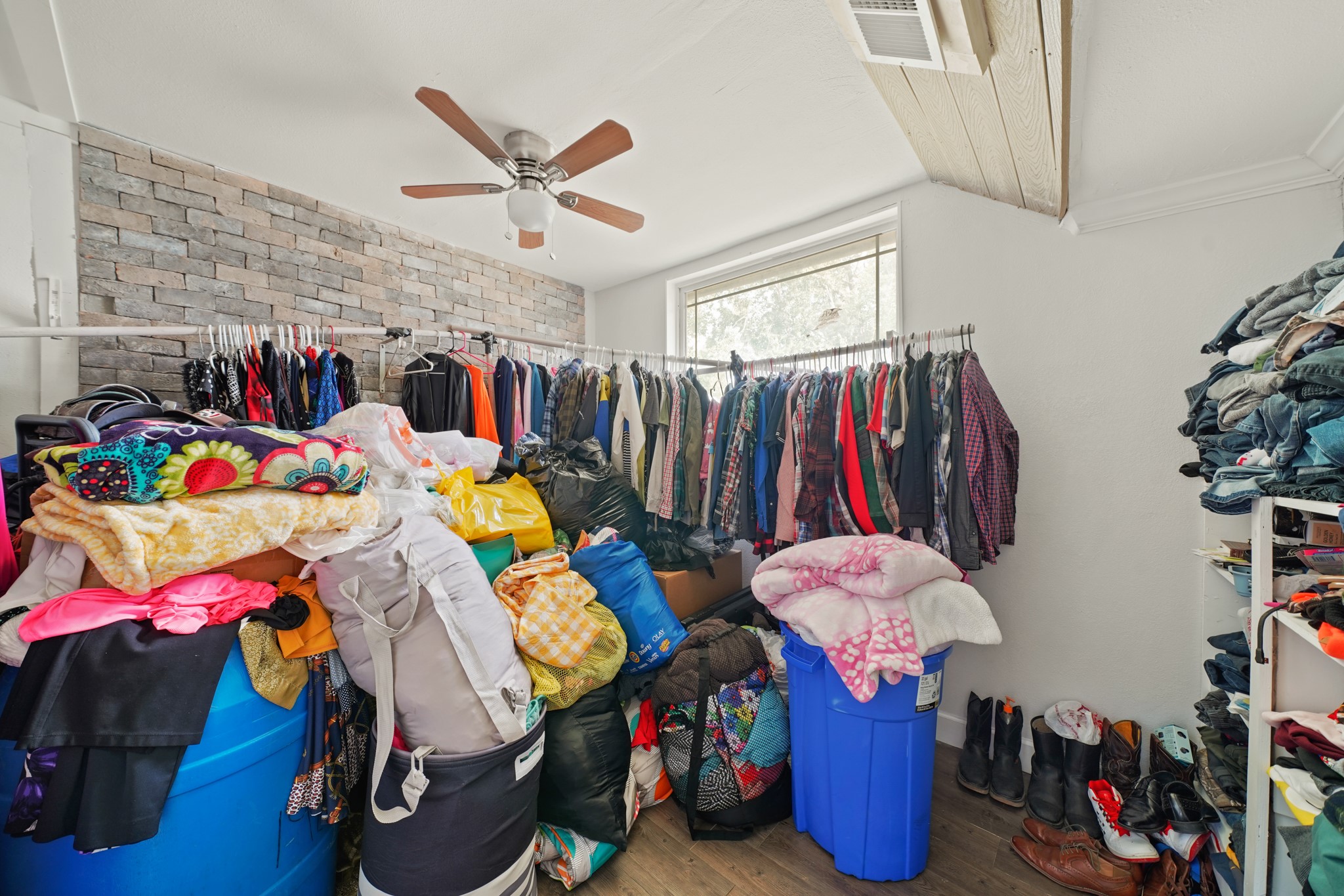 5307 Crane Street Houston, TX 77026 - Photo 9 of 41 4003 Lockwood -Discover a versatile room at 4003 Lockwood St., featuring a large window, ceiling fan, and ample storage possibilities. Perfect for any need!