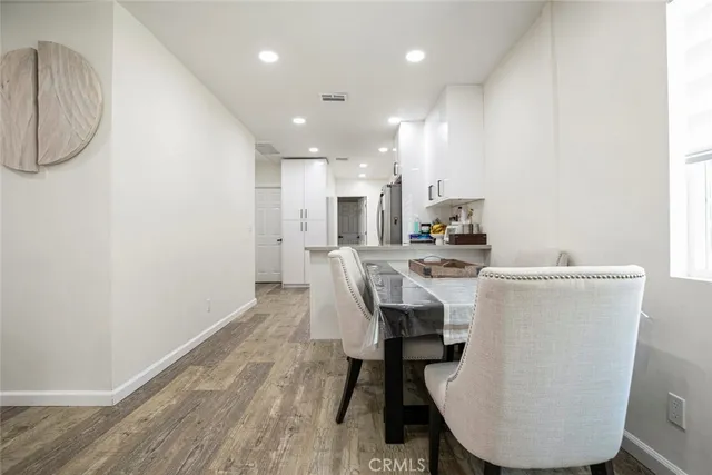 a kitchen with a stove a refrigerator and a sink