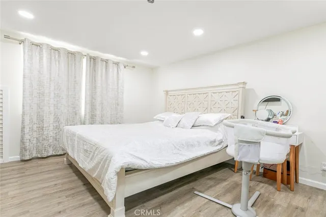 a large white bed in a large room