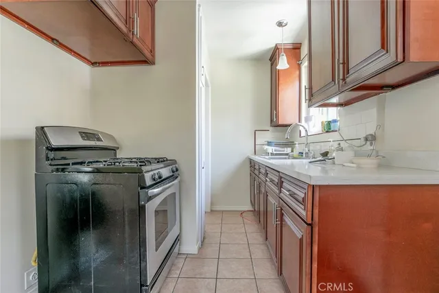 an empty room with wooden floor and cabinet
