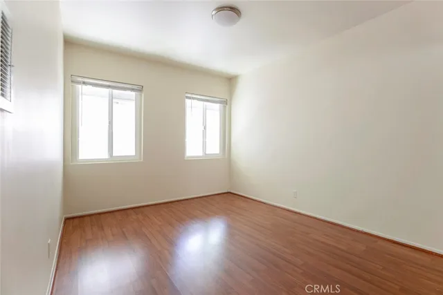 an empty room with wooden floor