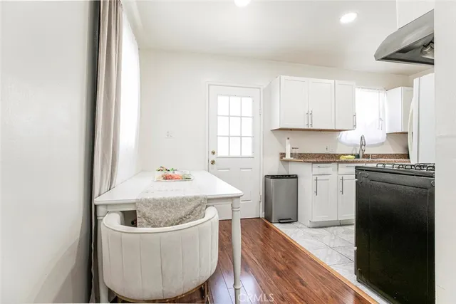 a stove top oven sitting inside of a kitchen