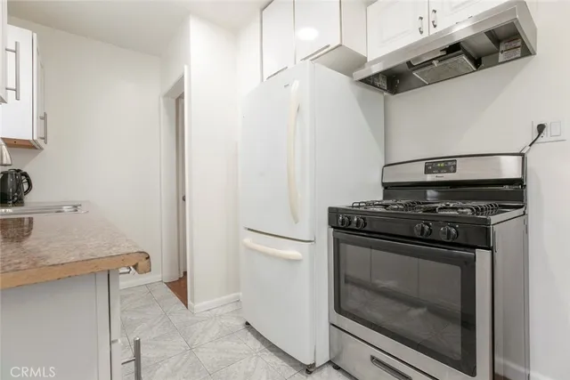 a bedroom with a bed and a mirror