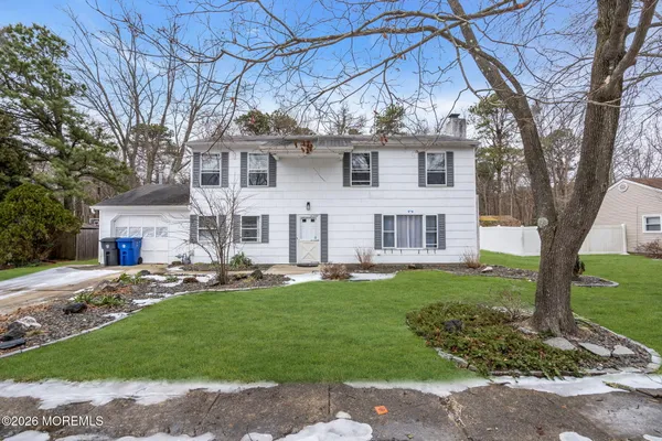 a view of a yard in front of house with a yard