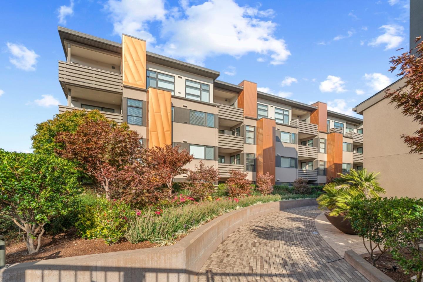 1838 Ogden Drive, Unit 413 Burlingame, CA 94010 - Photo 1 of 23 a front view of a building