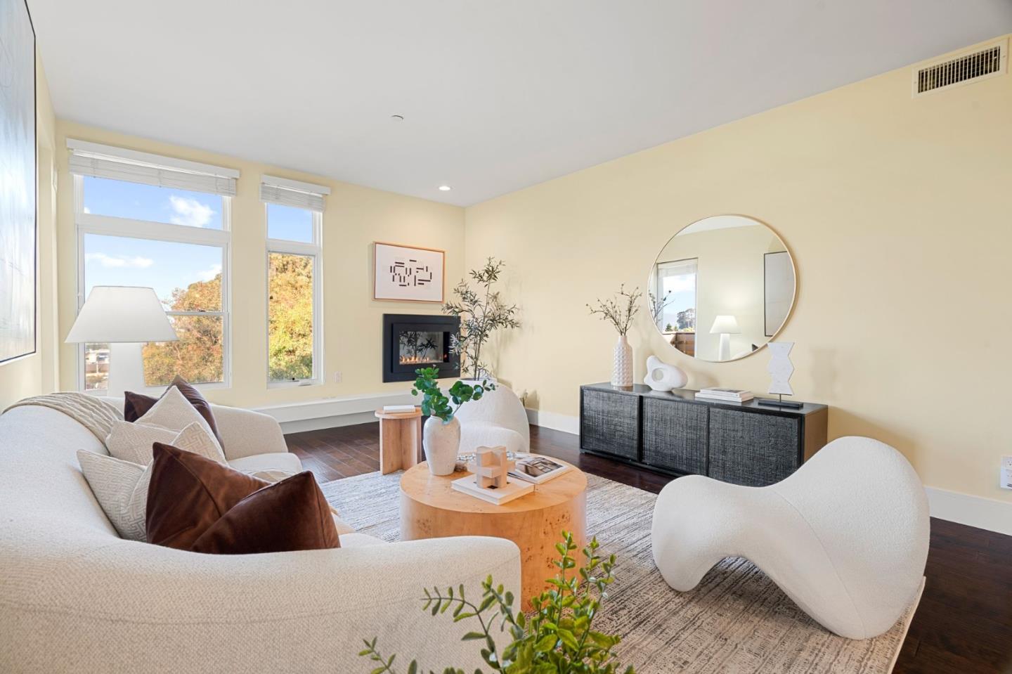 1838 Ogden Drive, Unit 413 Burlingame, CA 94010 - Photo 2 of 23 a living room with furniture and a fireplace
