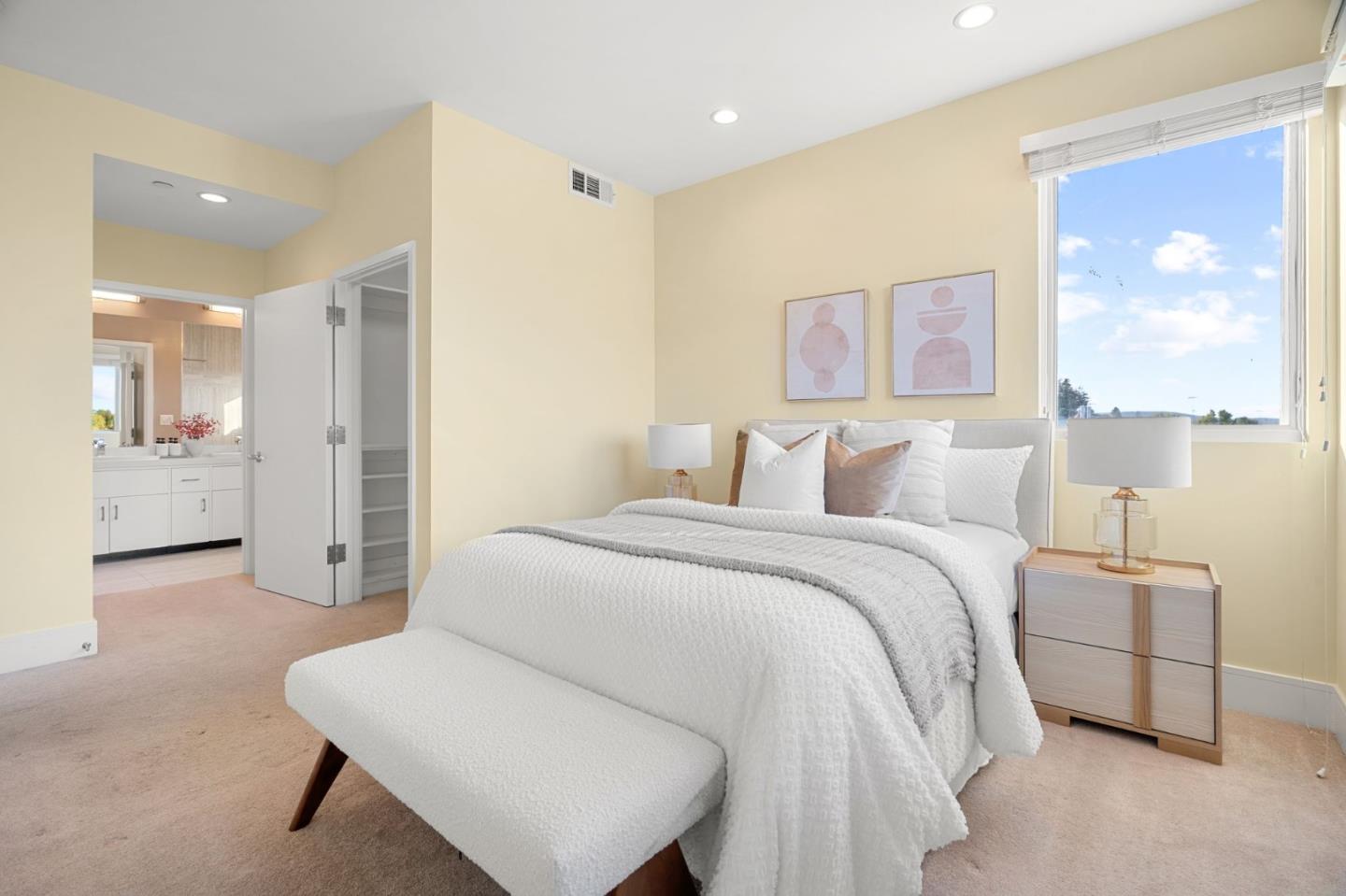 1838 Ogden Drive, Unit 413 Burlingame, CA 94010 - Photo 9 of 23 a bedroom with a bed and a painting on the wall