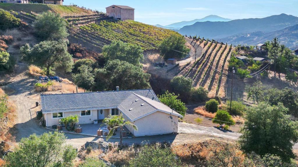 an aerial view of a house with a garden