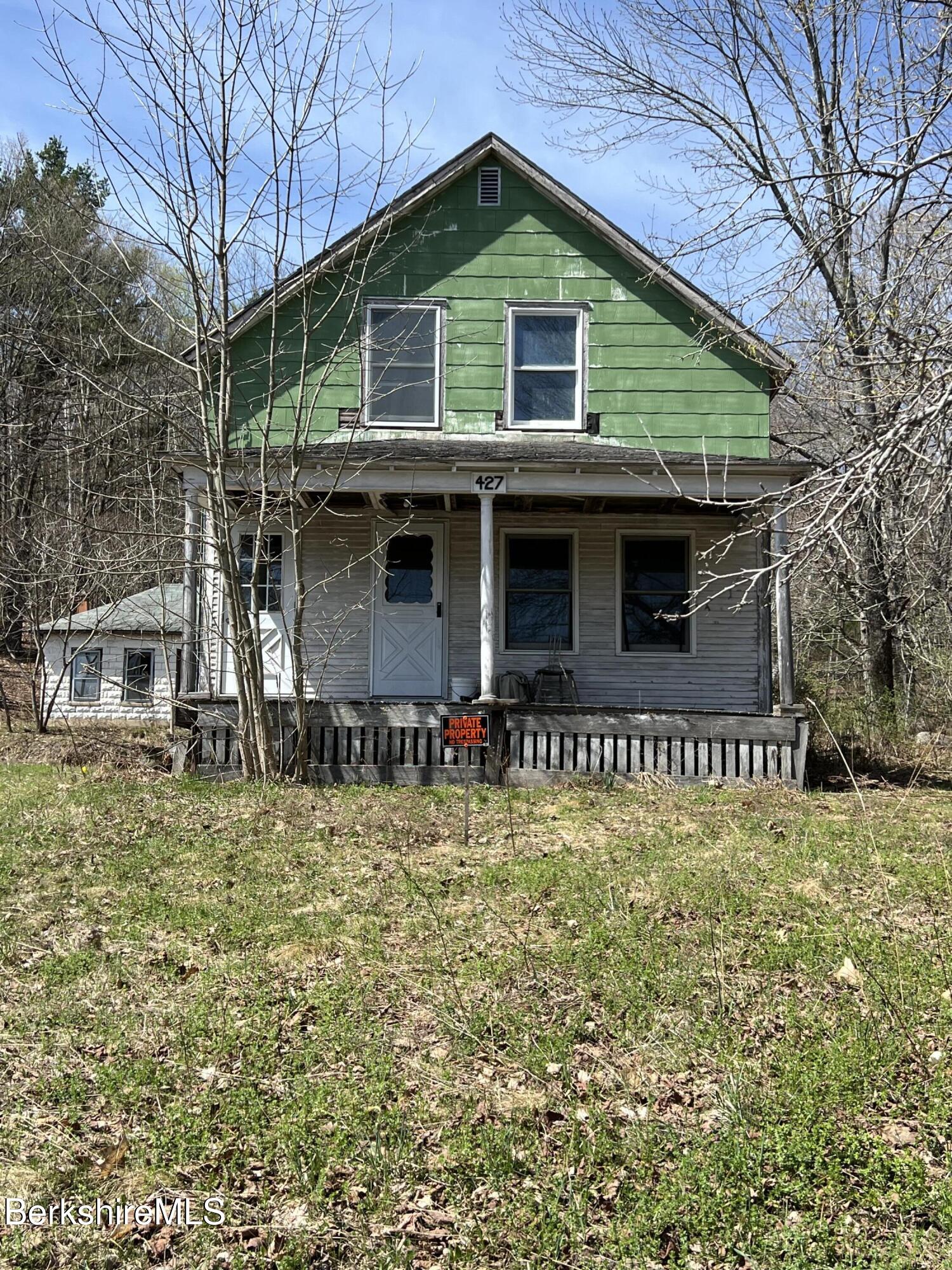 427 W Road Clarksburg, MA 01247 - Photo 1 of 6 a front view of a house with garage