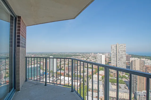 an aerial view of residential building and ocean