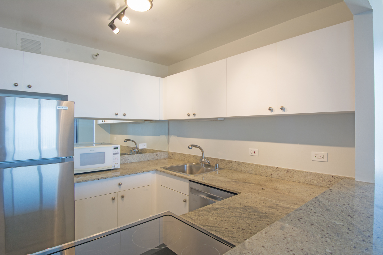 3660 North Lake Shore Drive, Unit 3910 Chicago, IL 60613 - Photo 13 of 25 a kitchen with a sink cabinets and appliances
