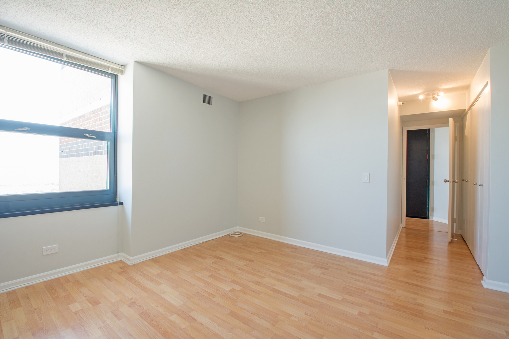 3660 North Lake Shore Drive, Unit 3910 Chicago, IL 60613 - Photo 16 of 25 a view of empty room with wooden floor and fan