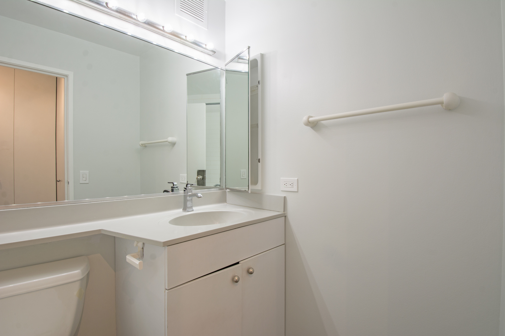 3660 North Lake Shore Drive, Unit 3910 Chicago, IL 60613 - Photo 18 of 25 a bathroom with a sink and a mirror