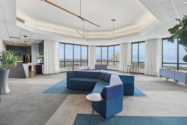 3660 North Lake Shore Drive, Unit 3910 Chicago, IL 60613 - Photo 21 of 25 a living room with furniture and a large window