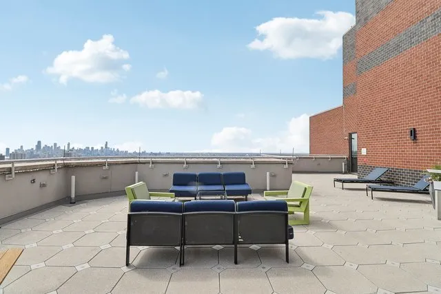 a lobby with furniture and a potted plant