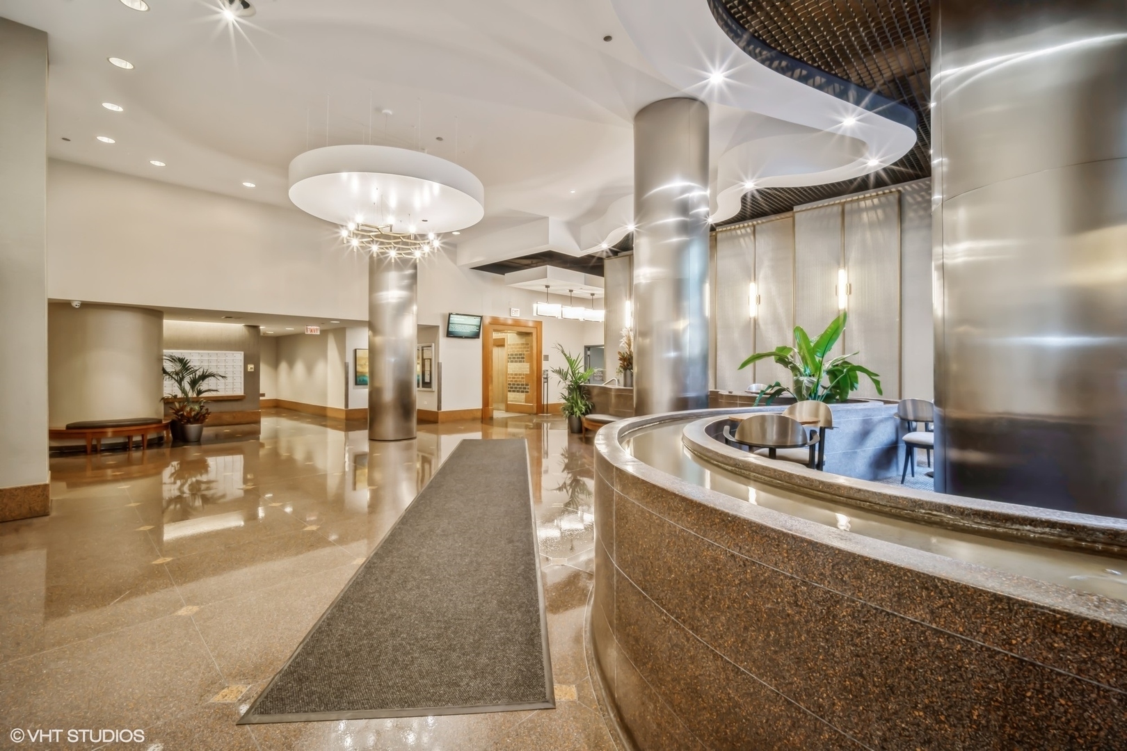 3660 North Lake Shore Drive, Unit 3910 Chicago, IL 60613 - Photo 5 of 25 a view of a living room and chandelier