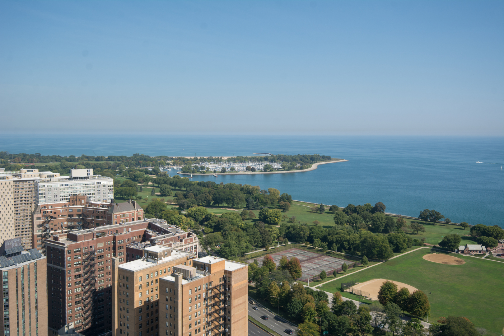 3660 North Lake Shore Drive, Unit 3910 Chicago, IL 60613 - Photo 10 of 25 an aerial view of a city with lots of residential buildings