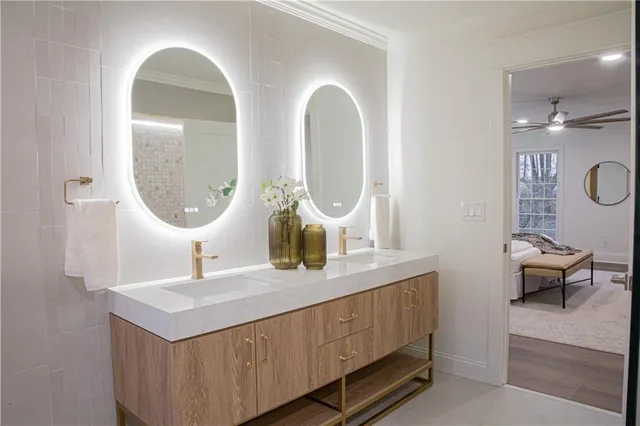 a bathroom with a double vanity sink and a mirror
